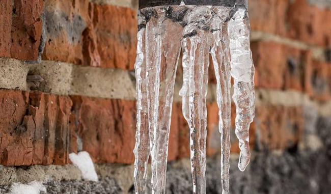 natural icicles hanging on the pipe SHZC X