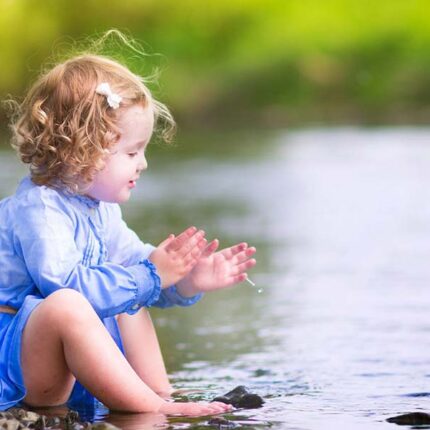 stock photo 40058290 adorable girl playing at river shore 1 1600x600